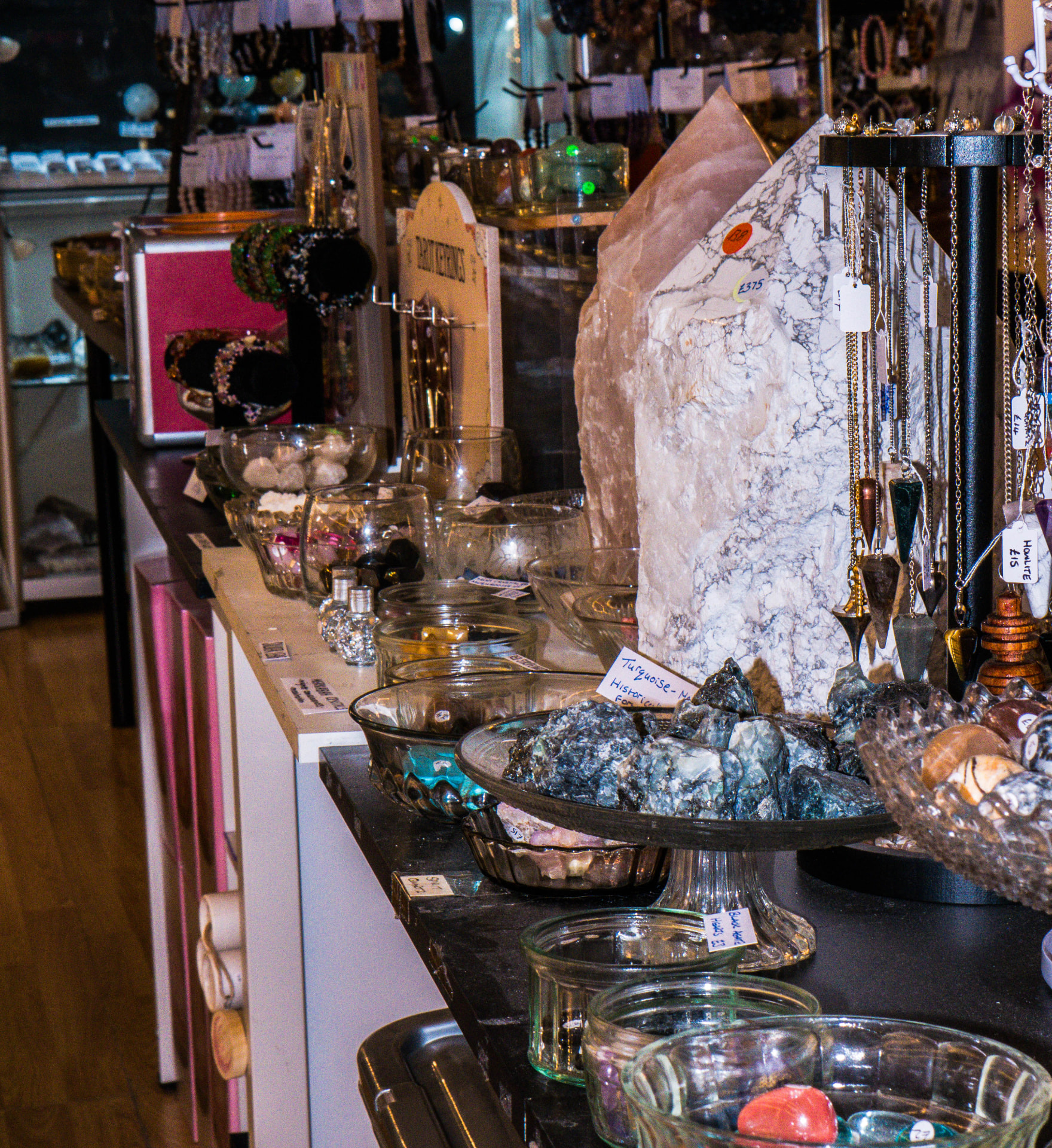 Crystal jewellery, gemstones and gift items arranged on the Hidden Treasures counter